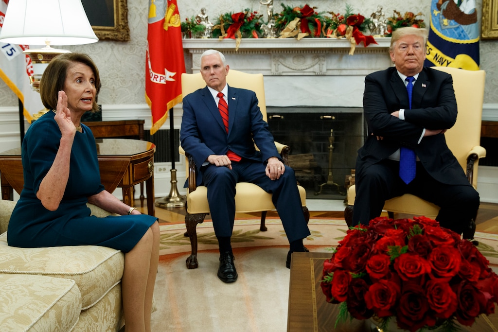 (Evan Vucci | The Associated Press) In this Tuesday, Dec. 11, 2018 file photo, Vice President Mike Pence, center, listens as President Donald Trump argues with House Minority Leader Rep. Nancy Pelosi, D-Calif., during a meeting in the Oval Office of the White House, in Washington. Across the world, people are questioning truths they had long held to be self-evident, and they are dismissing some of them as fake news. They are replacing traditions they had long seen as immutable with haphazard reinvention. In the United States, a president who some accuse of upending ideals that the nation holds dear is aggressively abandoning protocol and customs that have prevailed through a dozen of his predecessors.