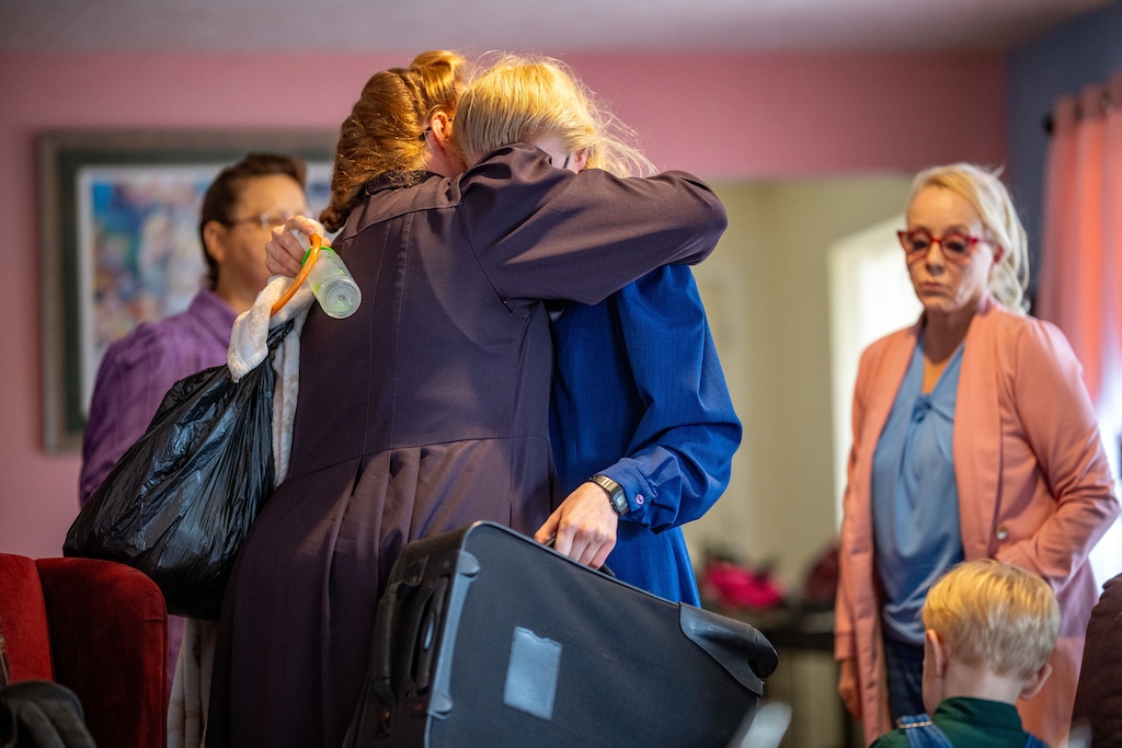(Trent Nelson | The Salt Lake Tribune) Followers of Samuel Bateman embrace at Christine Marie's home after he was arrested during an FBI raid.