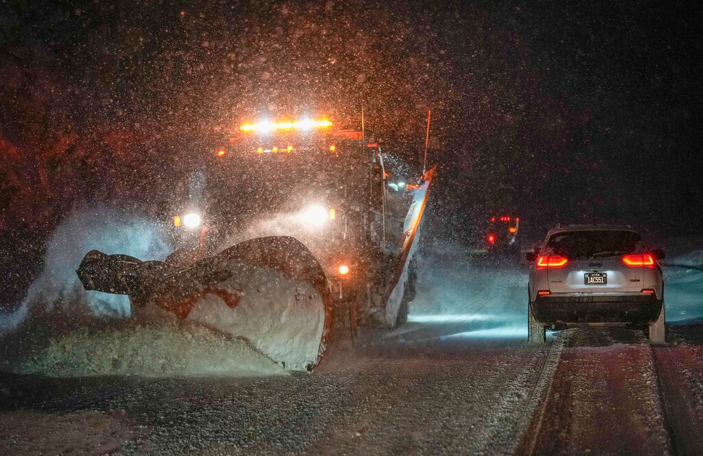 (Francisco Kjolseth  |  The Salt Lake Tribune) Snowplows clear the road early in Big Cottonwood Canyon on Sunday, Jan. 7, 2024.