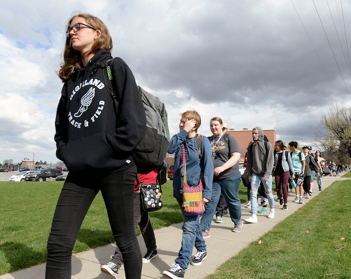 (Al Hartmann  |  The Salt Lake Tribune) 	
Over one hundred students at Highland High School staged a walkout Friday April 20, 2018 in honor of the anniversary of the Columbine High School massacre. Demonstrators walked from the school to Sugar House Park where they made posters, wrote letters to their congressmen and listened to speakers. 