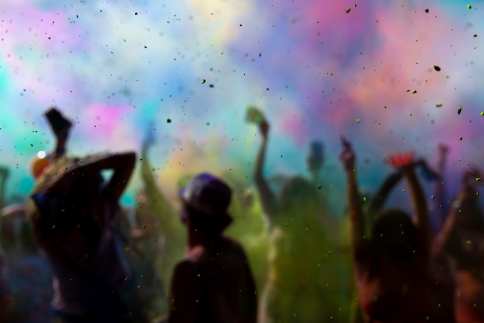 (Rachel Rydalch | The Salt Lake Tribune) Colored powder is thrown into the air as people celebrate at the Holi Festival of Colors at the Sri Sri Radha Krishna Temple in Spanish Fork on Saturday, March 26, 2022.