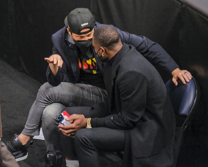 (Leah Hogsten | The Salt Lake Tribune) Utah Jazz basketball team majority owner and Qualtrics founder Ryan Smith and former Miami Heat guard and NBA champion Dwyane Wade talk as the Utah Jazz host the Indiana Pacers, April 16, 2021 at the Vivint Arena.