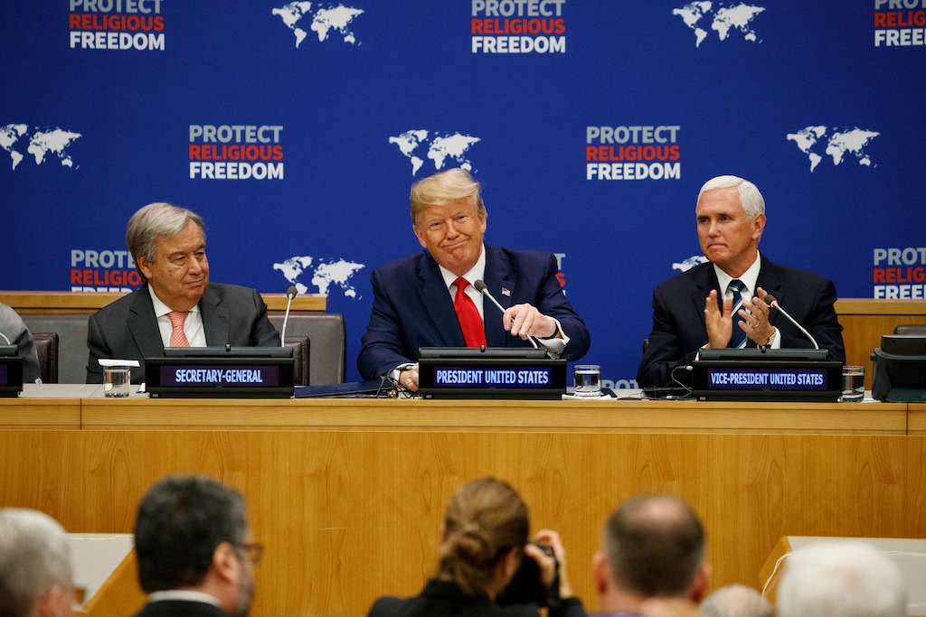 (AP Photo/Evan Vucci) United Nations Secretary-General Antonio Guterres, left, and Vice President Mike Pence, right, listen as President Donald Trump speaks at an event on religious freedom during the United Nations General Assembly, Monday, Sept. 23, 2019, in New York.