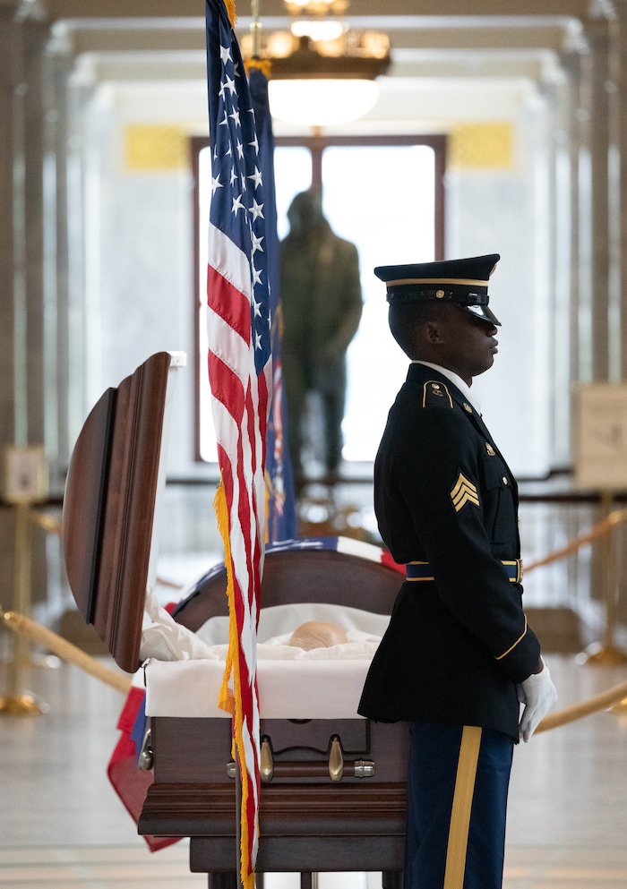 (Francisco Kjolseth | The Salt Lake Tribune) Army Sgt. Maurice Manns II stands at attention alongside the casket of former U.S. Sen. Orrin Hatch at the Utah Capitol on Wednesday, May 4, 2022.