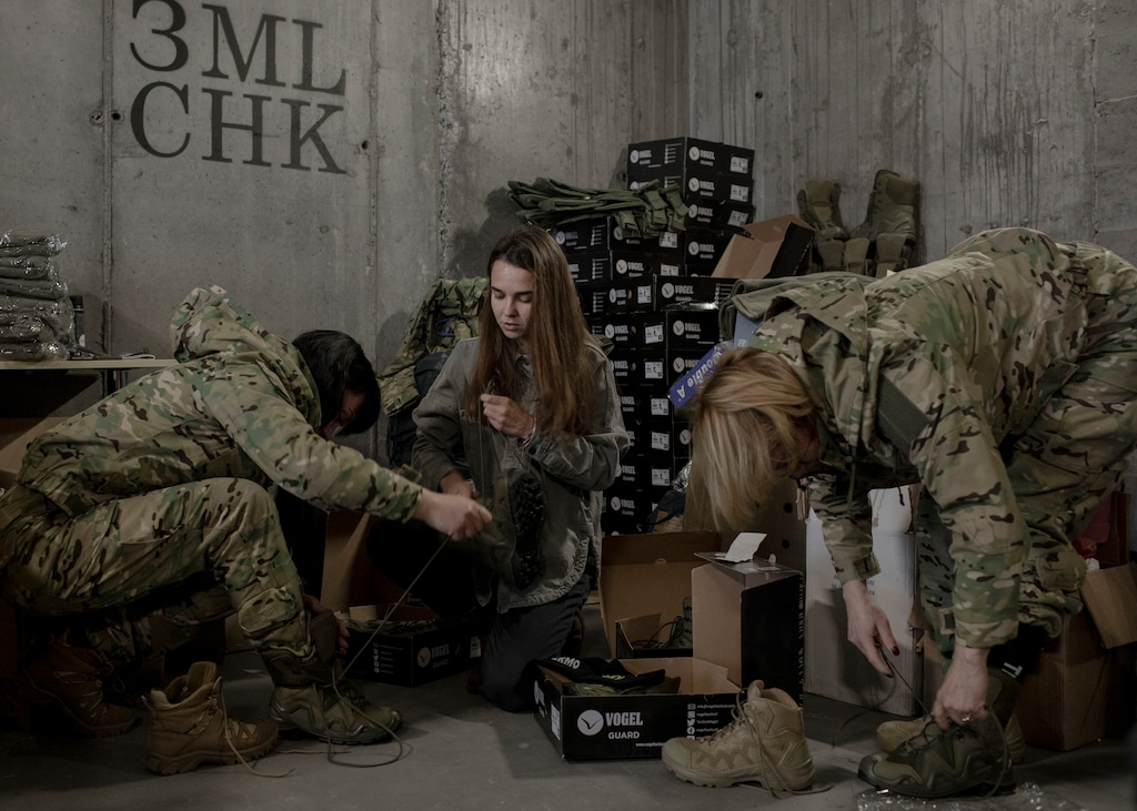 (Emile Ducke | The New York Times)
Kseniia Drahaniuk, center, whose nonprofit 'Zemliatchki' advocates for female Ukrainian soldiers, gives donated uniforms to Mariia Stalinska, left, and Liliia Fedorenko, right, on Kiyv, Ukraine, on Nov. 2, 2022. "The exhaustion with Western support for Ukraine may continue to gain ground in the coming months as people grow weary of high energy prices and, in the case of some European countries, possible rolling power cuts," writes New York Times columnist Nicholas Kristof.
