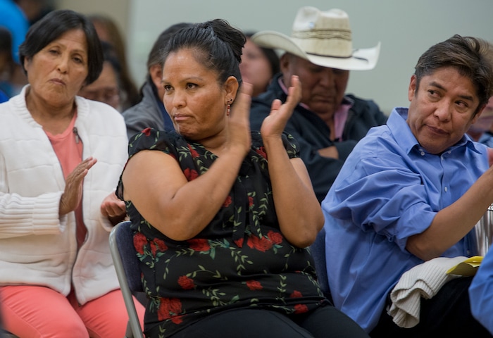 (Leah Hogsten  |  The Salt Lake Tribune)  l-r Mary Benally, her daughter Tara Benally and Terry Whitehat react to the opinions of their fellow San Juan County residents concerning newly draw redistricting lines in the county. San Juan County residents were presented with proposals of the newly redrawn county commission and school board districts during hearings in Monticello and Bluff, November 16, 2017. The redistricting proposals would redraw voting districts to ensure significant American Indian majorities in two of three County Commission districts and on four of five school board voting districts as the result of a January 2012 lawsuit filed in U.S. District Court by the Navajo Nation. The lawsuit seeks the redrawing of voting districts to reflect the 2010 U.S. Census. Last year, U. S. District Court Judge Robert Shelby ruled the voting districts in the sprawling southeastern Utah county, which today is home to 16,895 residents, are unconstitutional and violate the rights of American Indians. He ordered the county to redraw them.
