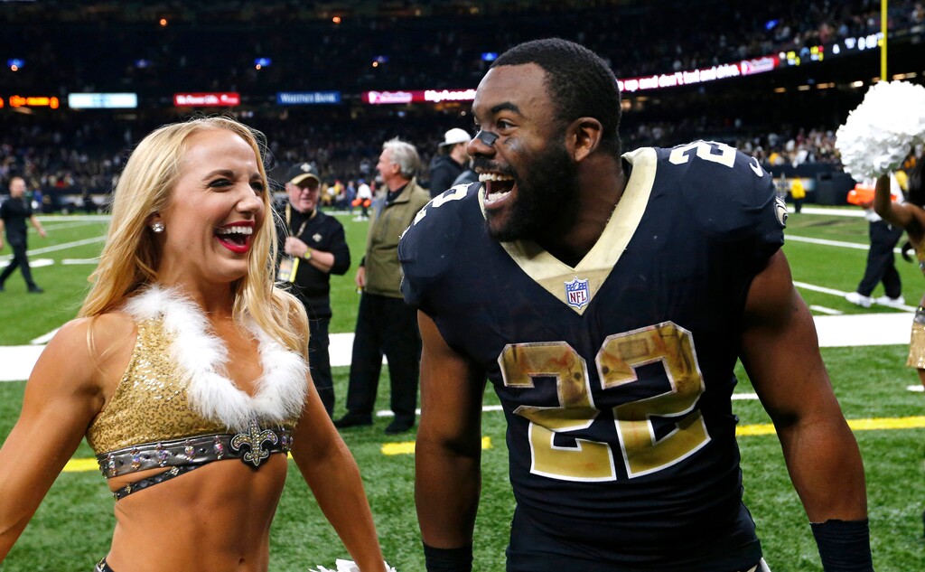 New Orleans Saints running back Mark Ingram (22) dances with cheerleaders after an NFL football game against the Atlanta Falcons in New Orleans, Sunday, Dec. 24, 2017. The Saints won 23-13, clinching a playoff berth. (AP Photo/Butch Dill)