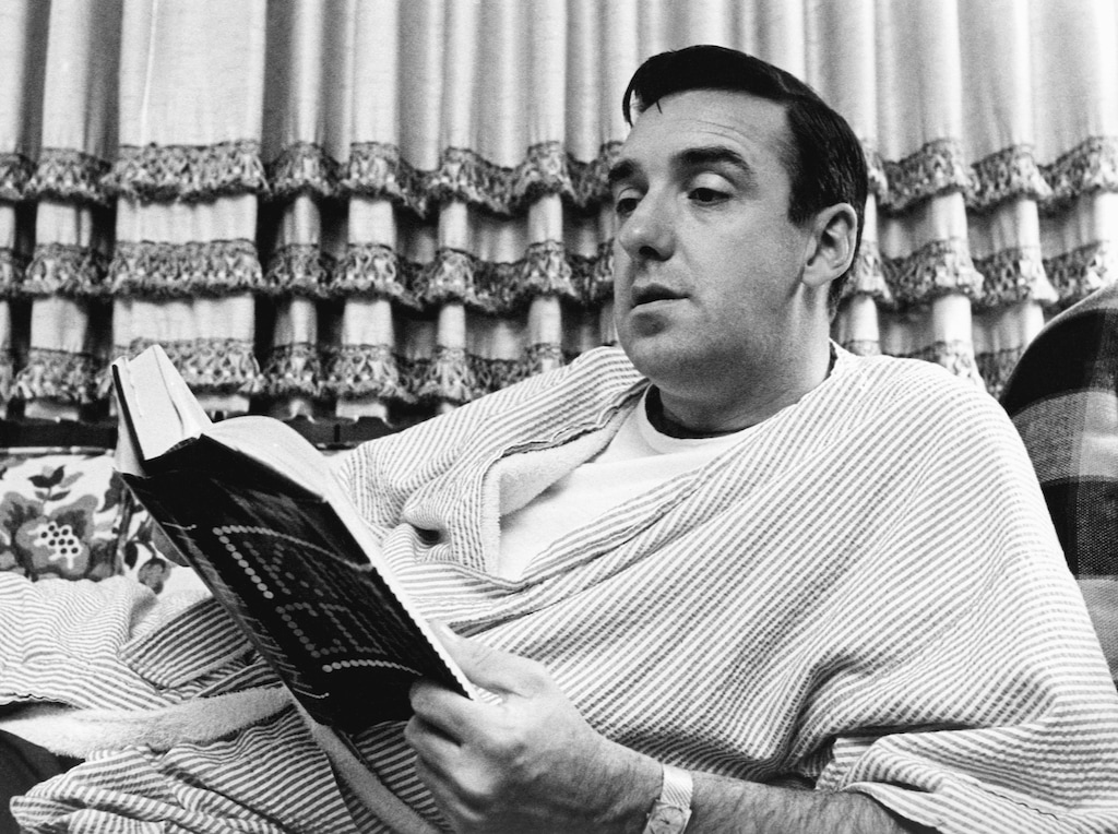 FILE - In this Nov. 14, 1967 file photo, singer and actor Jim Nabors, best known for his role as Gomer Pyle on "The Andy Griffith Show," reads a book at his California home. Nabors was among the notable figures who died in 2017.  (AP Photo/File)