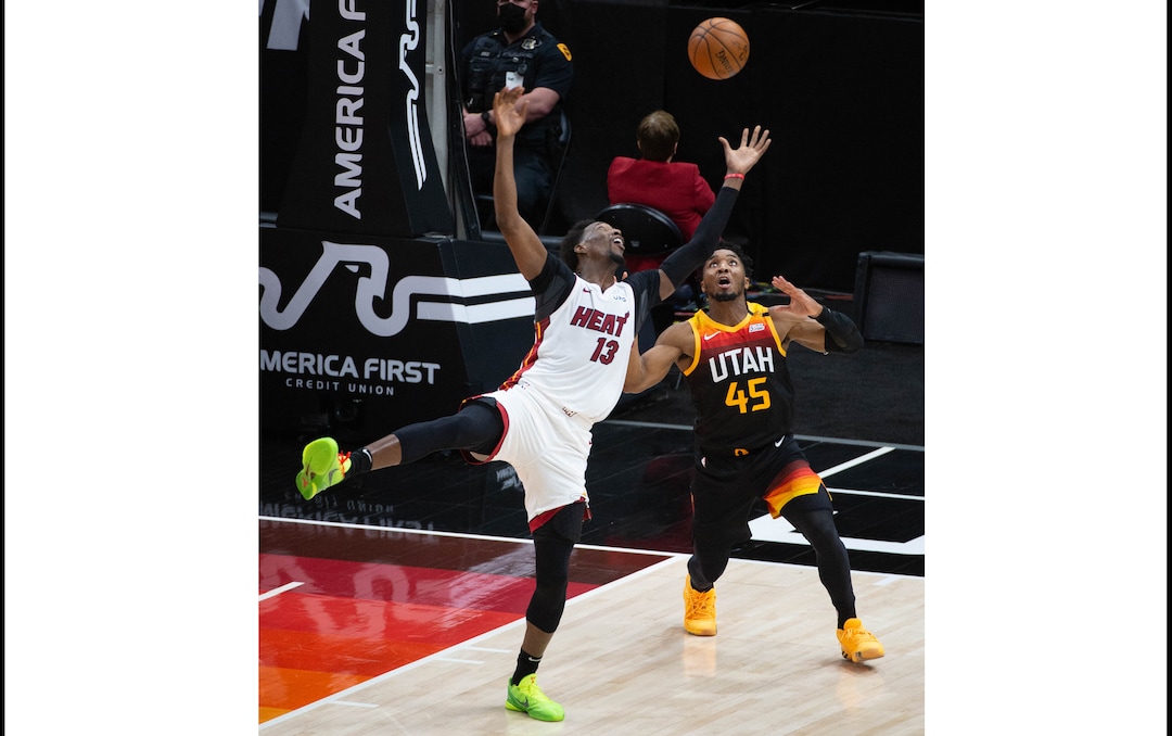 (Francisco Kjolseth  | The Salt Lake Tribune) Miami Heat center Bam Adebayo (13) leans back for the ball against Utah Jazz guard Donovan Mitchell (45) as the Utah Jazz take on the Miami Heat at Vivint Smart Home Arena in Salt Lake City, on Saturday, Feb. 13, 2021.