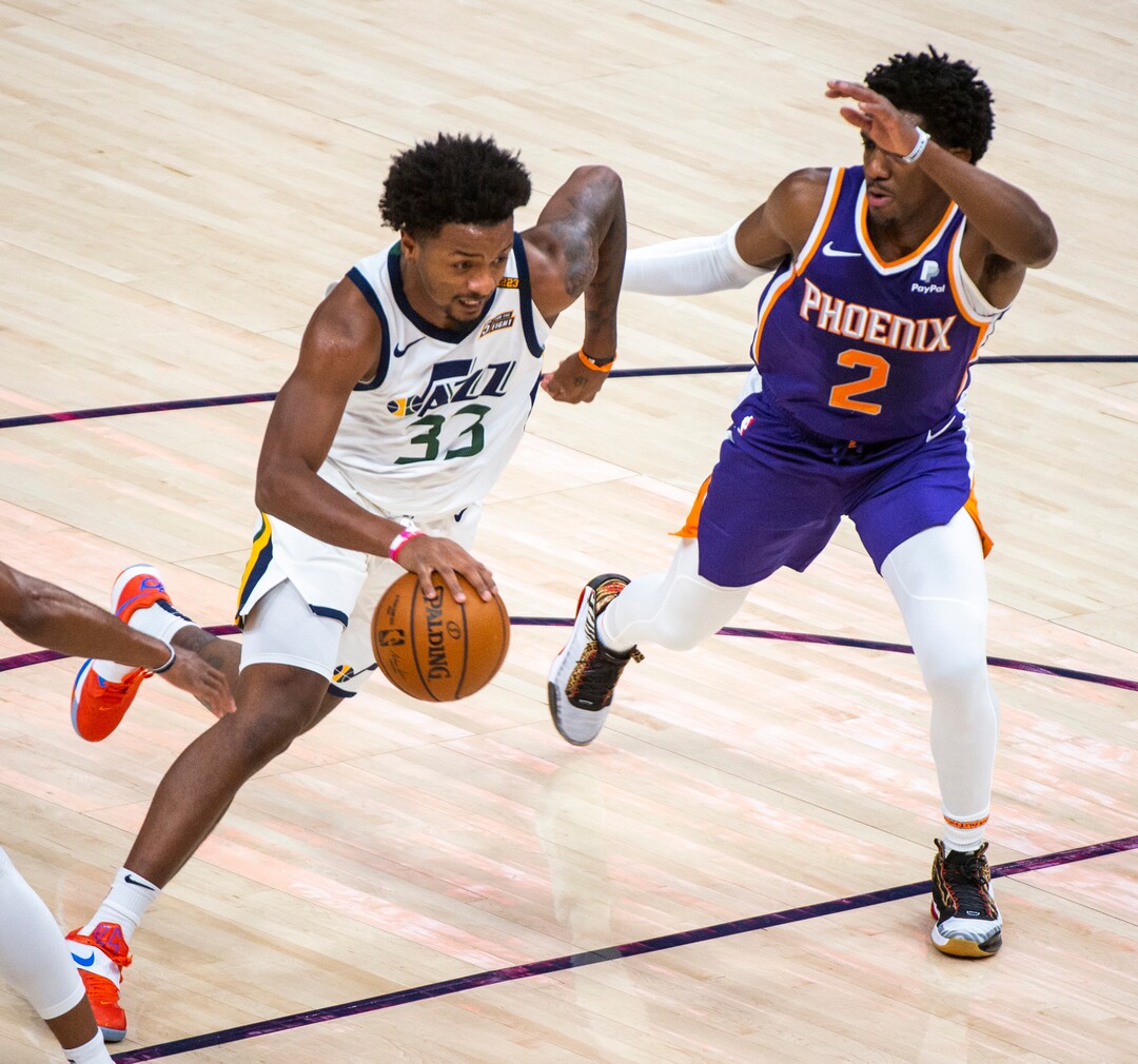 (Rick Egan | The Salt Lake Tribune)  Utah Jazz forward Elijah Hughes (33) drives as Phoenix Suns guard Langston Galloway (2) defends, in preseason NBA action between Utah Jazz and Phoenix Suns at Vivint SmartHome Area, on Saturday, Dec. 12, 2020.