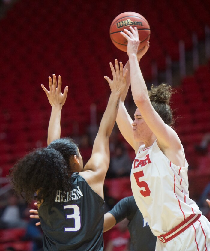 (Rick Egan  |  The Salt Lake Tribune)      Utah Utes center Megan Huff (5) shoots over Washington Huskies forward Mai-Loni Henson (3), in PAC-12 women's basketball action at the Jon M. Huntsman Center, Sunday, Feb. 18, 2018.