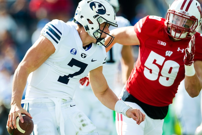 (Chris Detrick  |  The Salt Lake Tribune)  Brigham Young Cougars quarterback Beau Hoge (7) is chased down for a safety by Wisconsin Badgers linebacker Tyler Johnson (59) during the game at LaVell Edwards Stadium Saturday Saturday, September 16, 2017. Wisconsin Badgers defeated Brigham Young Cougars 40-6.