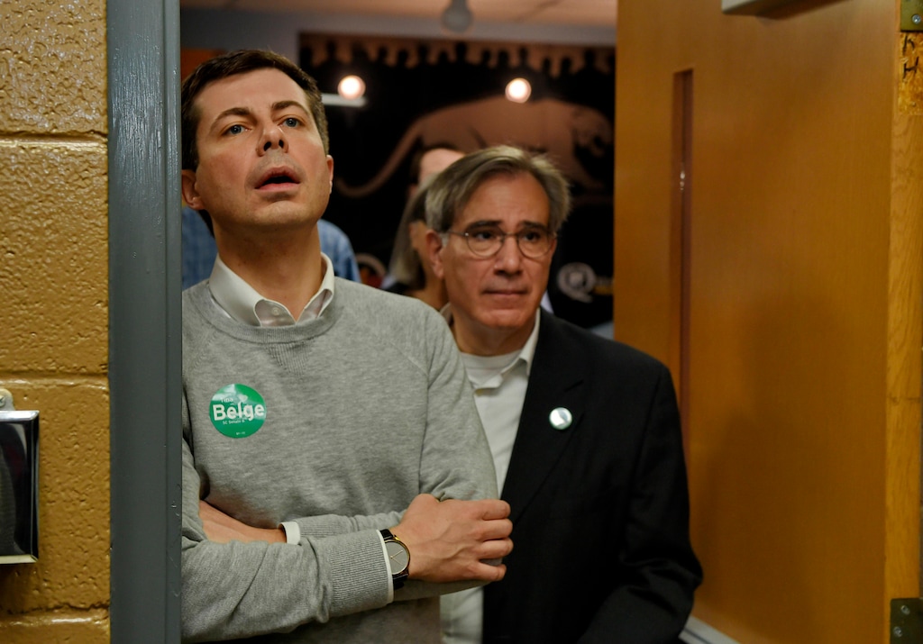 South Bend Mayor Pete Buttigieg, left, waits to speak to the crowd about his Presidential run during the Democratic monthly breakfast held at the Circle of Friends Community Center in Greenville, S.C. Saturday, March 23, 2019. Paul Merlo, right, GCDP volunteer coordinator, waits to escort Mayor Pete into the hall. (AP Photo/Richard Shiro)
