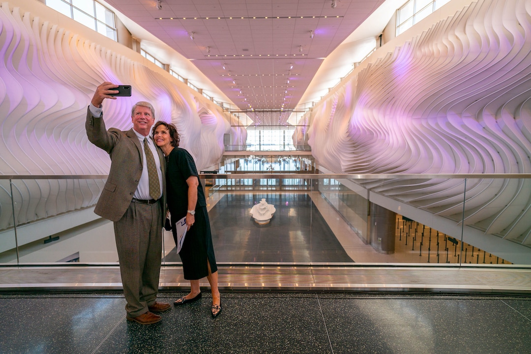 (Trent Nelson  |  The Salt Lake Tribune) Larry and Tammy Pinnock take a selfie with The Canyon, an art installation at the new Salt Lake City International Airport on Thursday, Aug. 27, 2020.