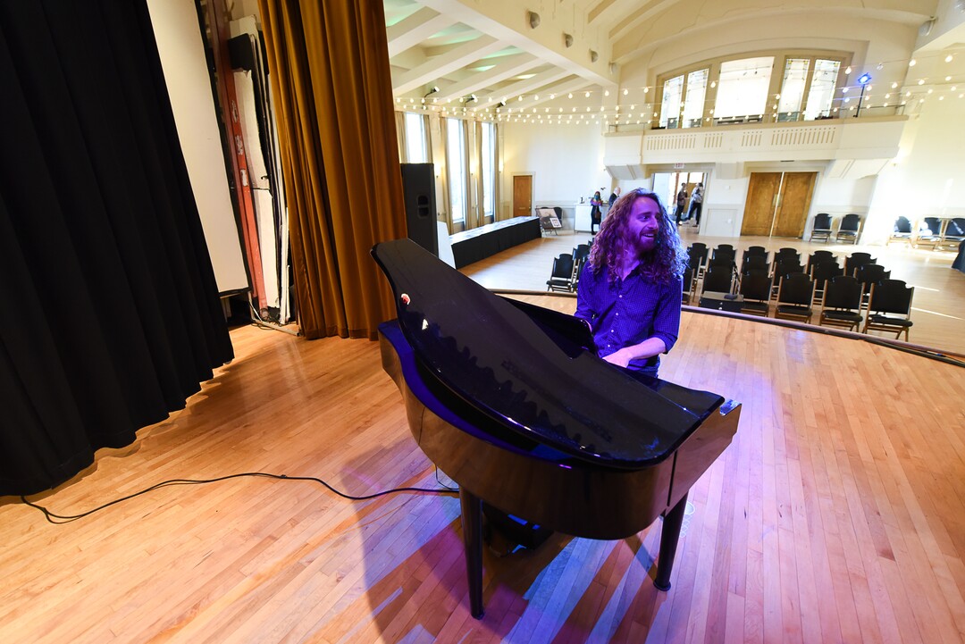 (Francisco Kjolseth  |  The Salt Lake Tribune)  Pianist Jared Gilmore provides the music at the historic Ladies Literary Club House during an open house on Tuesday, Sept. 24, 2019. Since 2016, the building at 850 E South Temple has been owned by a group of millennial visual artists and entrepreneurs, known as Photo Collective Studios. They've renovated the building and are now seeking a grant to make it ADA accessible for the first time in its 106-year history.
