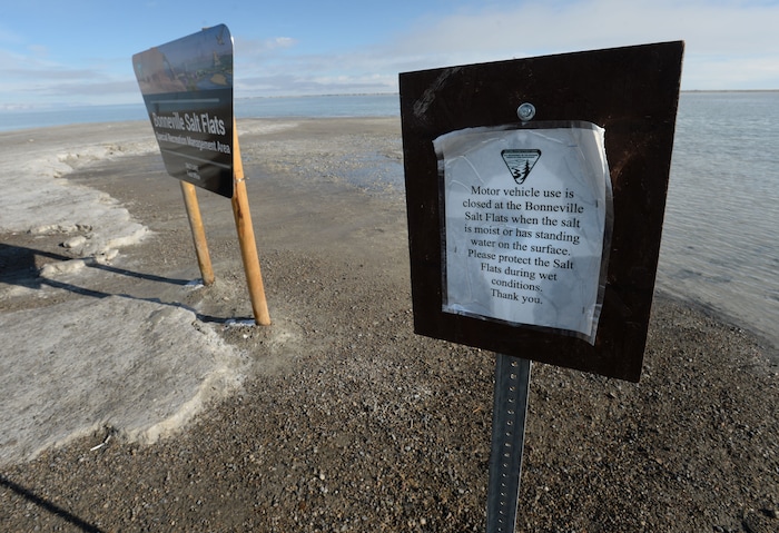 (Steve Griffin / Tribune file photo)  A sign warns drivers not to drive on the mud at the end of the road at Bonneville Salt Flats International Speedway, seen here in January 2017.