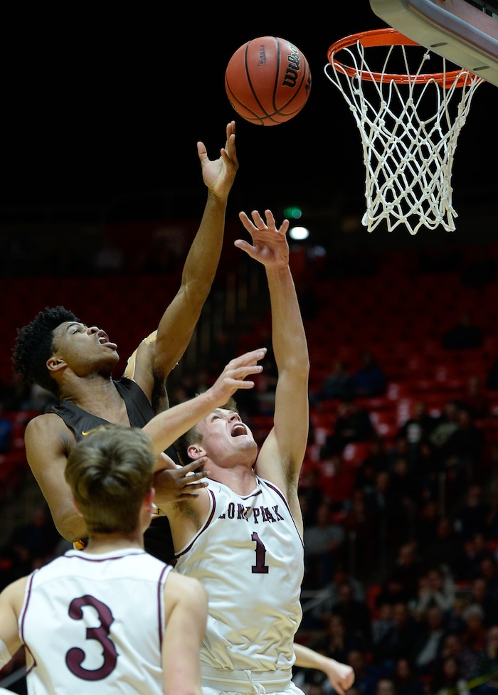 (Francisco Kjolseth  |  The Salt Lake Tribune)  Davis vs Lone Peak, 6A State high school basketball tournament at the Huntsman Center in Salt Lake City, Thursday March 1, 2018. Davis' Brendon Redford (12) shoots over Max Brenchley (1). 