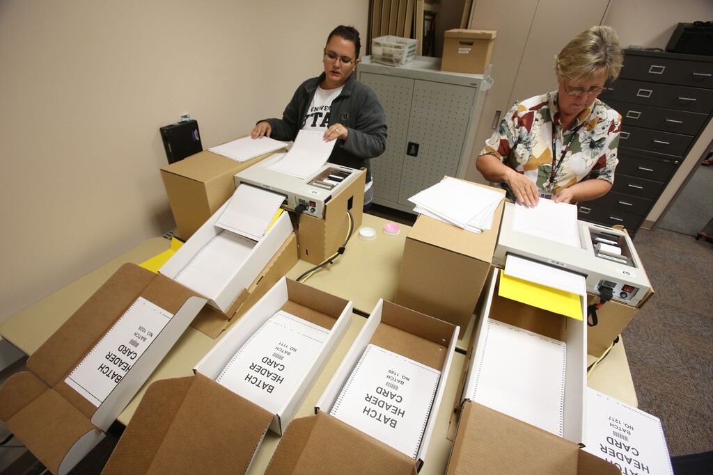 Francisco Kjolseth  |  The Salt Lake Tribune

Elections coordinators Antigone Carlson, left, and Barbara Beckstrom use optical scanners to count absentee or vote-by-mail ballots for the Salt Lake County Clerk's Office.