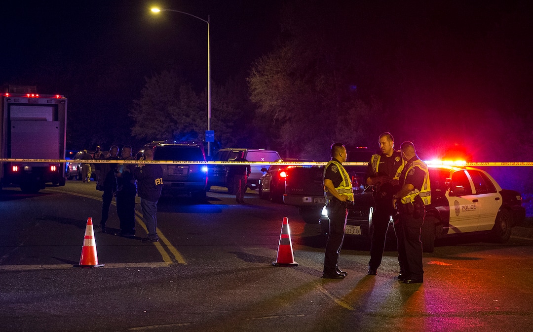 Authorities work the scene of an explosion in Austin, Texas, Sunday, March 18, 2018. At least a few people were injured in another explosion in Texas' capital late Sunday, after three package bombs detonated this month in other parts of the city, killing two people and injuring two others. (Nick Wagner/Austin American-Statesman via AP)