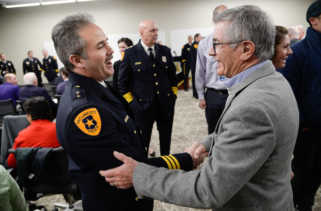 (Francisco Kjolseth  |  The Salt Lake Tribune)  Deputy Chief  Craig Vargo, left, greets former Salt Lake City Mayor Ted Wilson during a ceremony for the airport police, established in 1984, to retire their patch and badge on Tuesday, Feb. 26, 2019, as they are subsumed into the Salt Lake City Police Department. 
