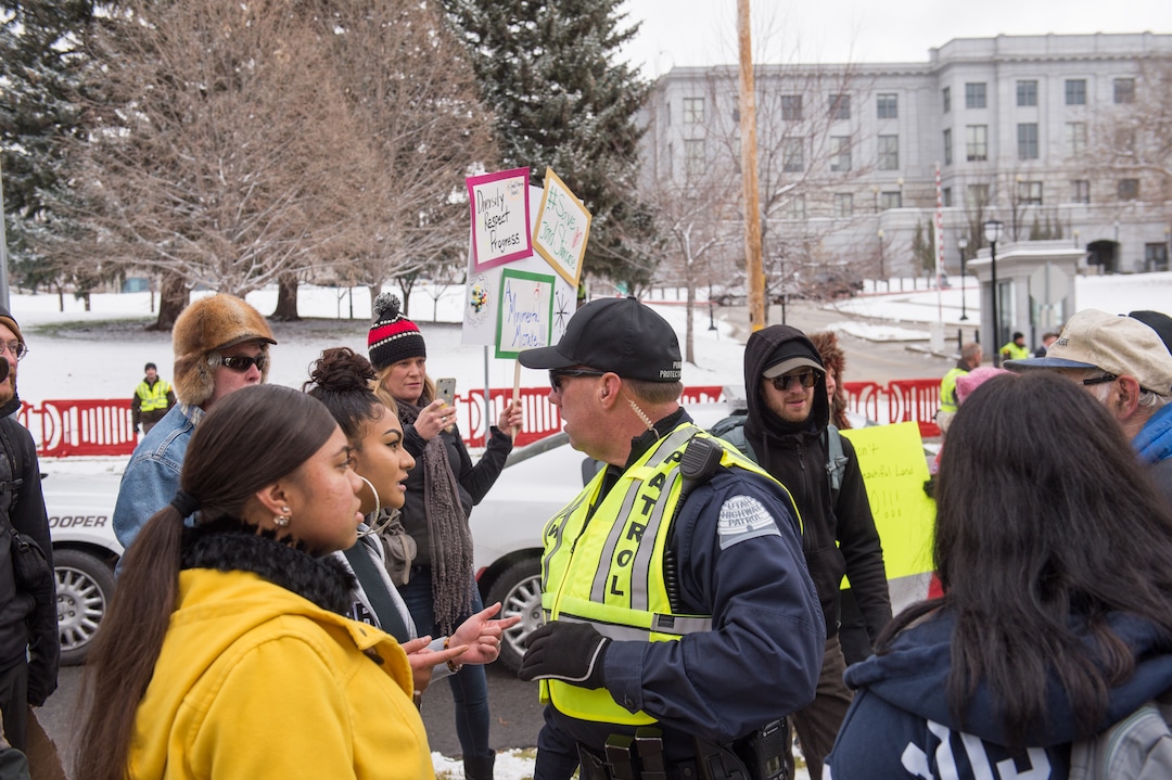 (Rachel Molenda  |  The Salt Lake Tribune)  A police officer separates protesters and a Trump supporter outside the capitol building in Salt Lake City, Utah, on Monday, December 4, 2017.