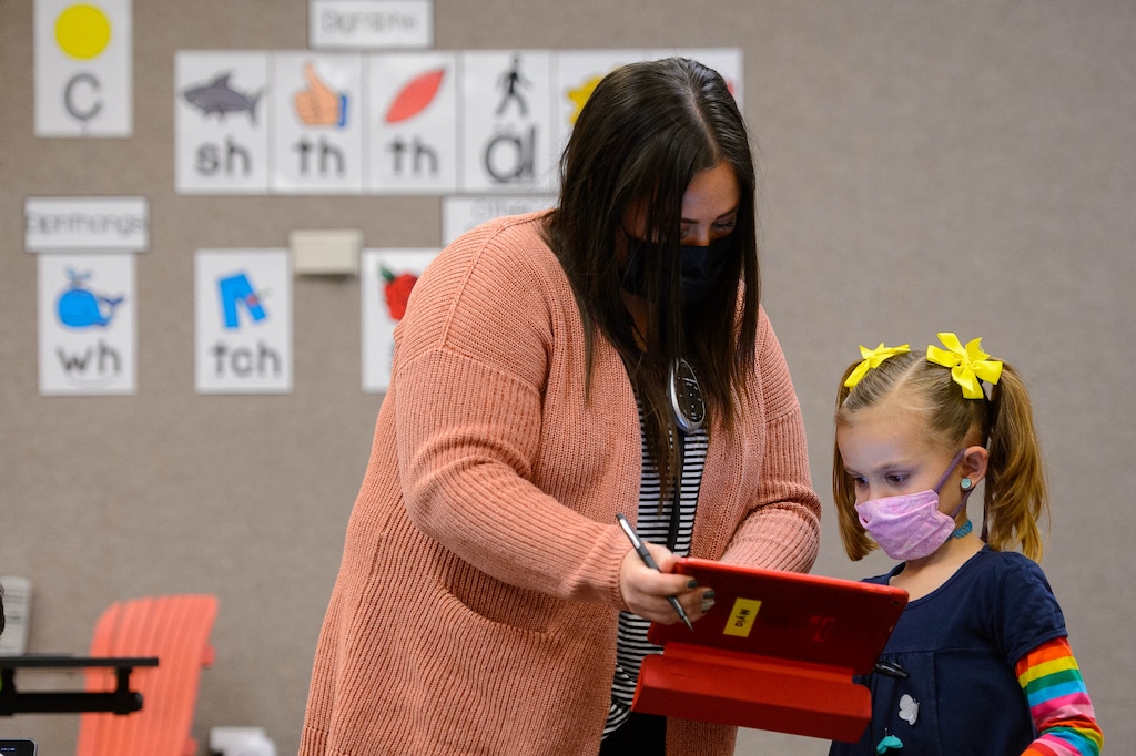 (Trent Nelson  |  The Salt Lake Tribune) Marci Weatherspoon works on a reading assignment with Myla Rider in her first grade class at Crescent Elementary in Sandy on Thursday, Dec. 10, 2020.