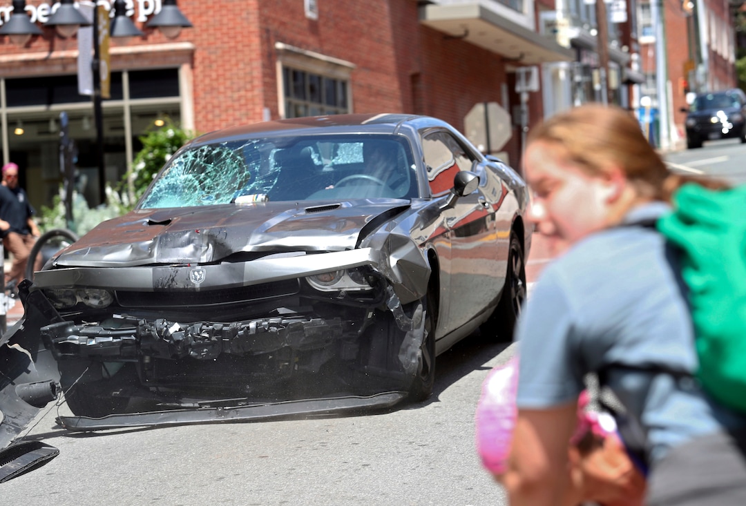 (Ryan M. Kelly  |  The Daily Progress via AP)  A vehicle reverses after driving into a group of protesters demonstrating against a white nationalist rally in Charlottesville, Va., Saturday, Aug. 12, 2017. The nationalists were holding the rally to protest plans by the city of Charlottesville to remove a statue of Confederate Gen. Robert E. Lee. There were several hundred protesters marching in a long line when the car drove into a group of them.