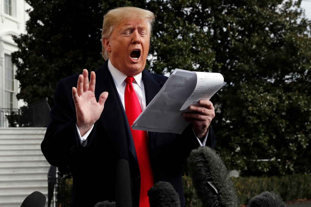 (Jacquelyn Martin  |  AP photo)President Donald Trump talks to the media on his way to the Marine One helicopter, Wednesday, Nov. 20, 2019, as he leaves the White House in Washington, en route to Texas. 