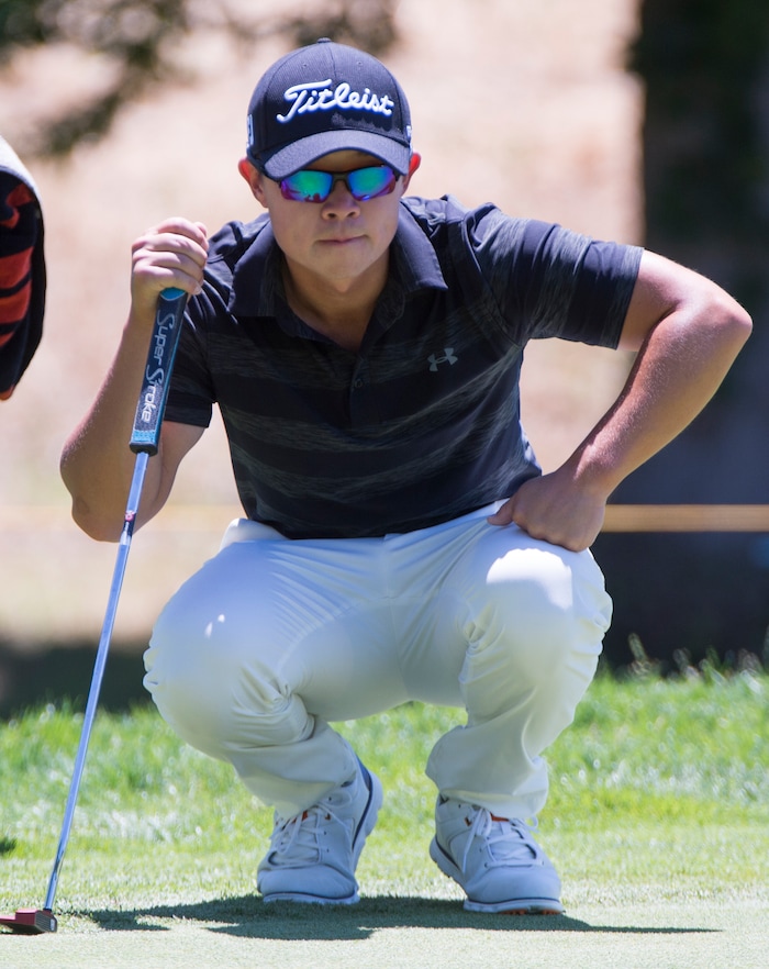 (Rick Egan  |  The Salt Lake Tribune)     Seokwon Jeon, from Draper Utah, looks over his putt during the second round of the Utah Championship golf event on the Web.com Tour at Oakridge Country Club in Farmington. July 13, 2018.



