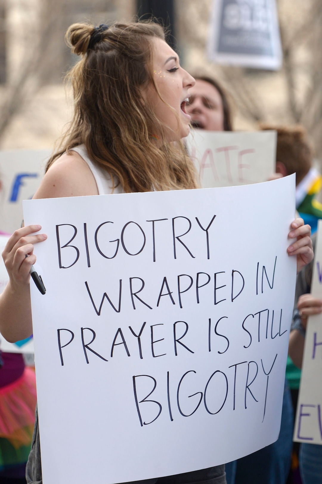 (Leah Hogsten  |  The Salt Lake Tribune) Maya Dettlin, who says she is a queer ex-Mormon, rallies with hundreds of other students and supporters Friday. Brigham Young University LGBTQ students took their concerns about the schoolÕs policy reversal regarding romantic behavior by same-sex couples to The Church of Jesus Christ of Latter-day Saints office building, Mar. 6, 2020. Despite removing the section on Òhomosexual behaviorÓ from BYU Honor Code last month, The LDS Church has clarified for the first time that same-sex romantic behavior is still Ònot compatibleÓ with the rules at BYU.