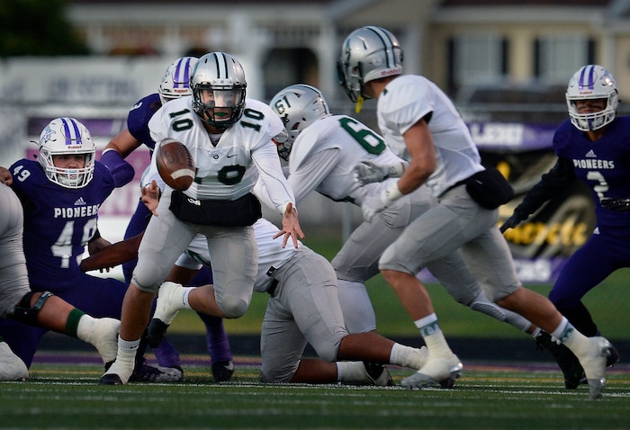 (Scott Sommerdorf   |  The Salt Lake Tribune)   Olympus QB Harrison Creer tosses to RB Watson Hoggan  during first half play. Lehi led Olympus 26-0 late in the second half, Friday, September 22, 2017.