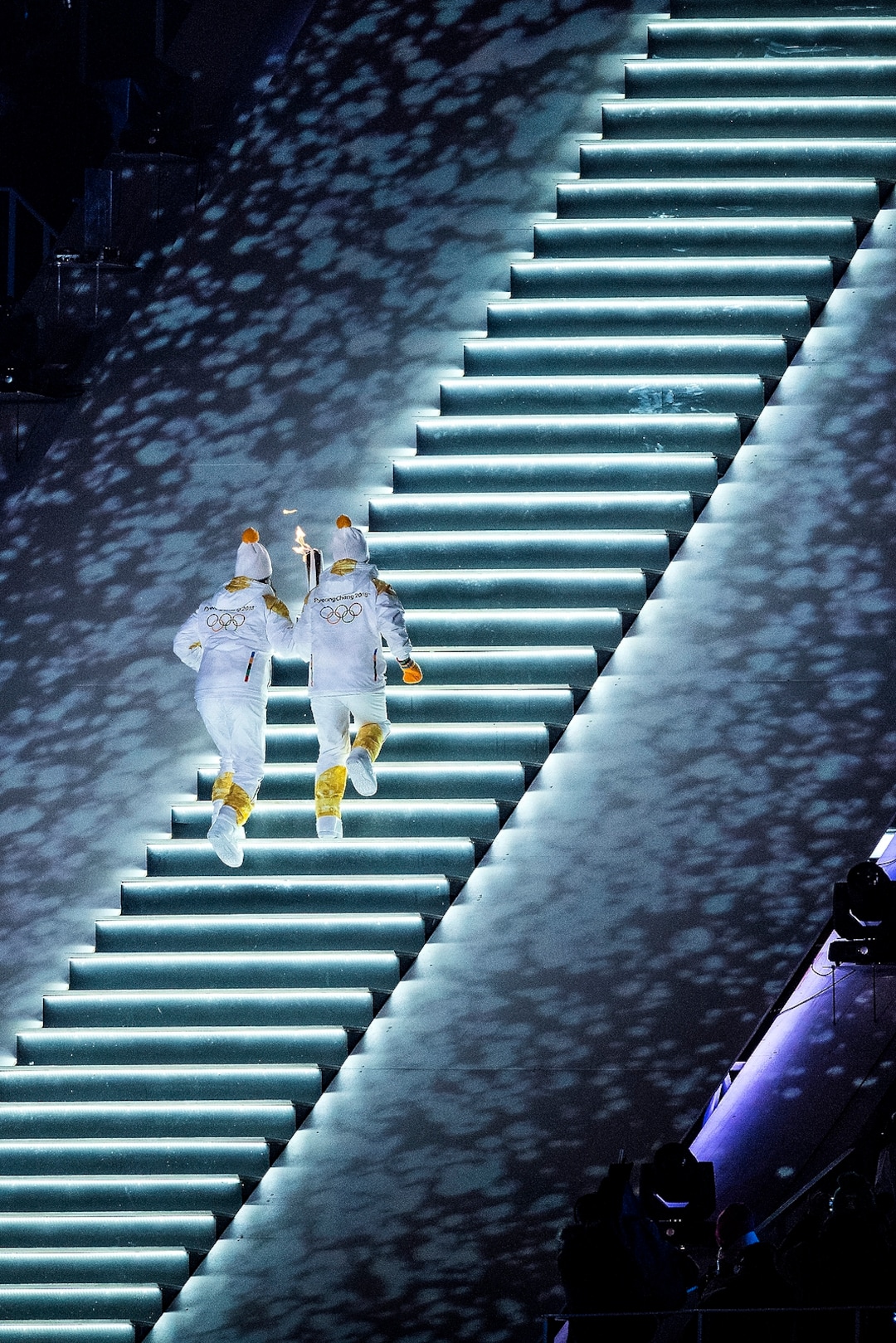 (Chris Detrick  |  The Salt Lake Tribune)  North Korea's Jong Su Hyon, left, and South Korea's Park Jong-ah carry the torch during the Pyeongchang 2018 Winter Olympics opening ceremony at Olympic Stadium Friday, February 9, 2018.  