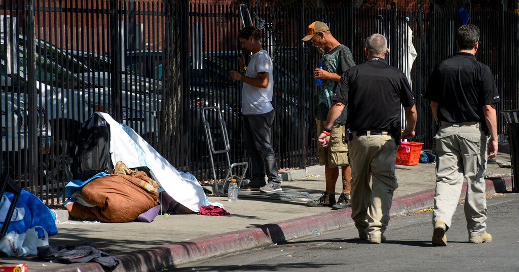 (Steve Griffin  |  Tribune file photo)  Law enforcement officers from several agencies increase their presence in the Rio Grand homeless area in Salt Lake City Monday August 14, 2017.