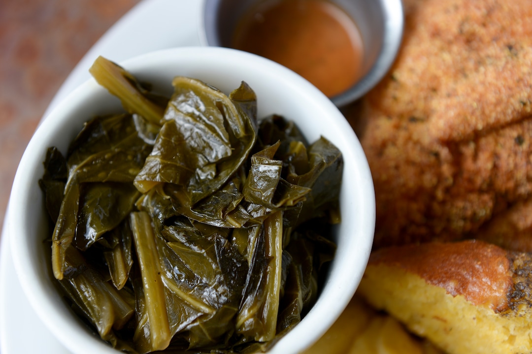 (Leah Hogsten  |  The Salt Lake Tribune)  Sauce Boss Southern Kitchen's collard greens, slow cooked with bacon, onion and garlic, $3.55. Chef Julius Thompson is expressing his love for his Southern roots at his restaurant, Sauce Boss Southern Kitchen, Sept. 10, 2019.