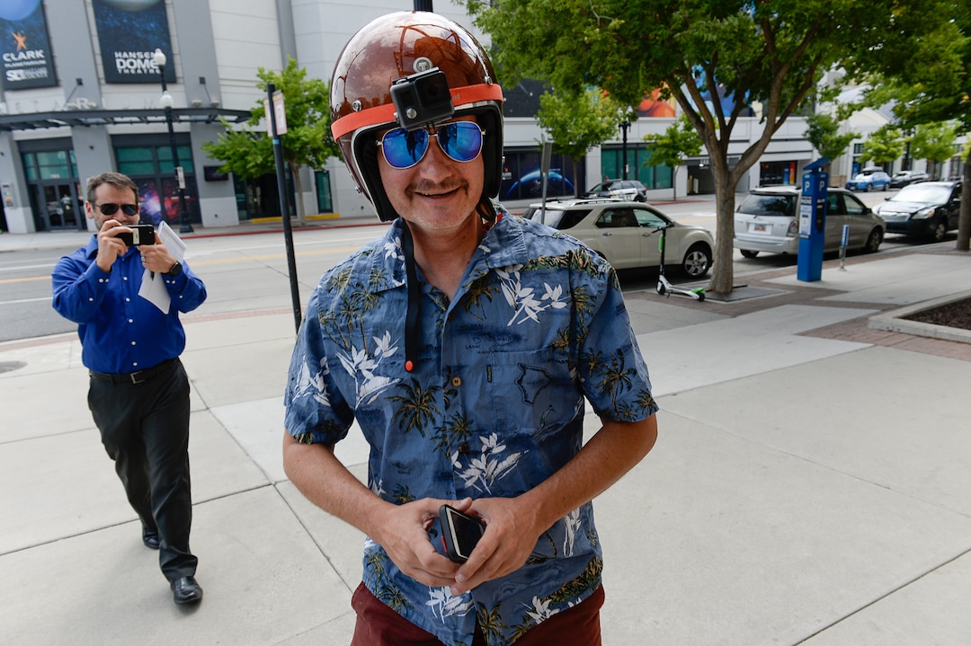 (Francisco Kjolseth  |  The Salt Lake Tribune)  Salt Lake Tribune columnist Robert Gehrke finishes his race against colleagues during a downtown transportation race from Library Square to the Tribune building at the Gateway on Thursday, Aug. 2, 2018. Modes of transportation included, rentable electric scooters, Green Bike, TRAX, Lyft, and walking.