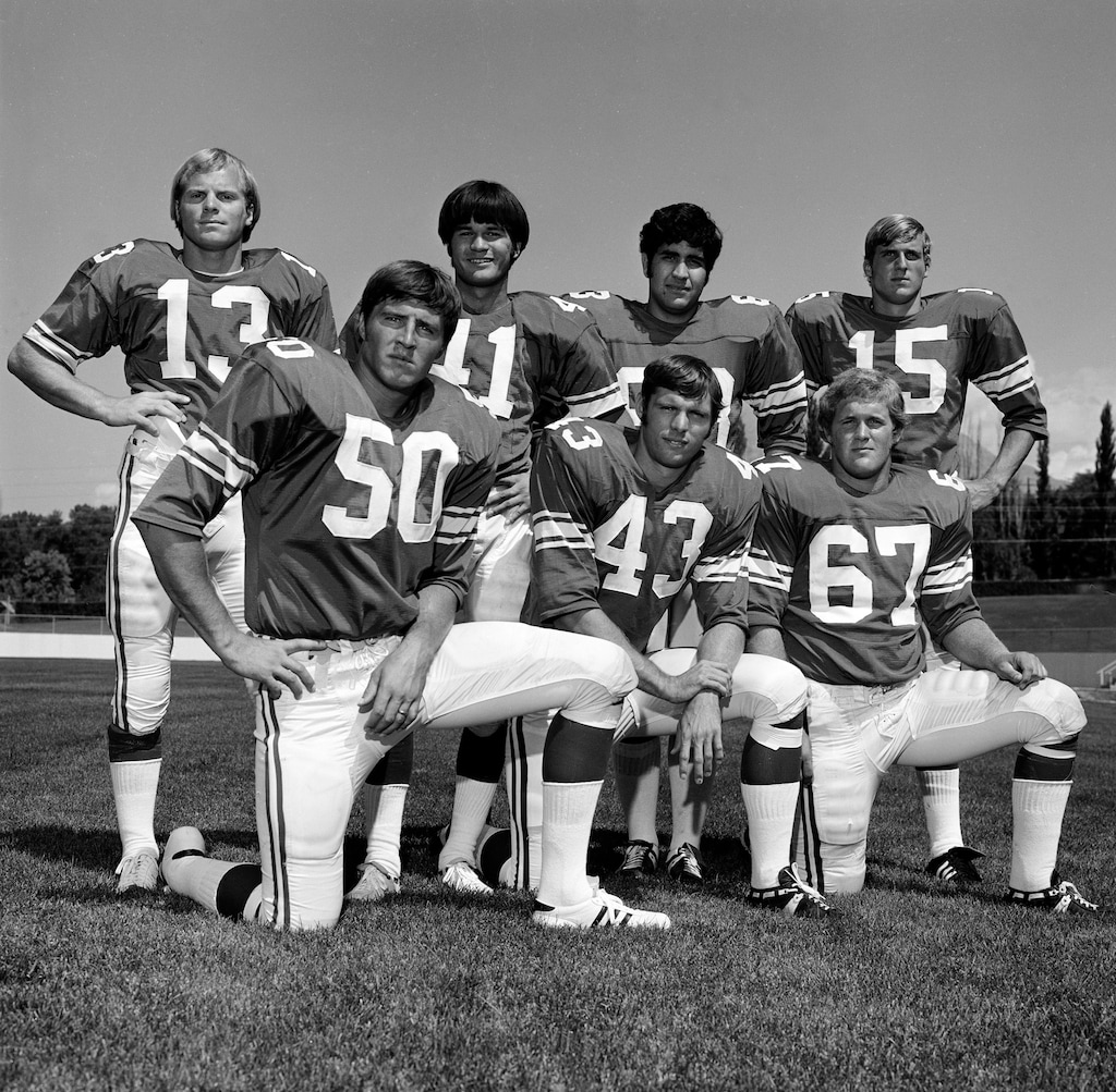 photo by Mark Philbrick/BYUMembers of the BYU football team, including Larry Carr (67), pose for a photo in 1973. 