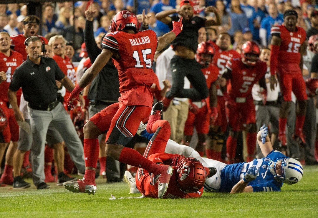 (Rick Egan  |  The Salt Lake Tribune)  The Utah bench celebrates as Ute  defensive back Jaylon Johnson (7) intercepts a pass intended for Brigham Young Cougars wide receiver Talon Shumway (21), in football action BYU vs Utah, at Lavell Edwards Stadium in Provo, Saturday, September 9, 2017.