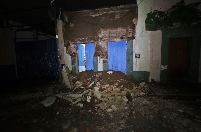 Debris from a collapsed wall sits in Oaxaca, Mexico, after an earthquake early Friday, Sept. 8, 2017. A massive 8-magnitude earthquake hit off the coast of southern Mexico late Thursday night, causing buildings to sway violently and people to flee into the street in panic as far away as the capital city.(AP Photo/Luis Alberto Cruz)