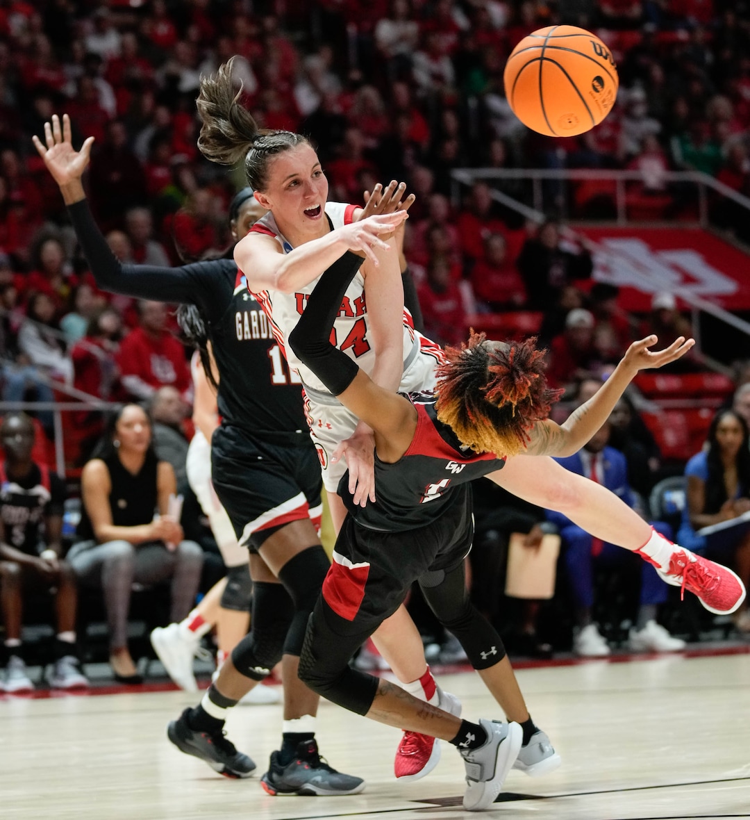 (Francisco Kjolseth | The Salt Lake Tribune) Utah Utes guard Kennady McQueen (24) passes the ball as she collides with Gardner-Webb Runnin' Bulldogs guard Ki'Ari Cain (1) of a first-round college basketball game in the NCAA Tournament, Friday, March 17, 2023, in Salt Lake City, Utah.