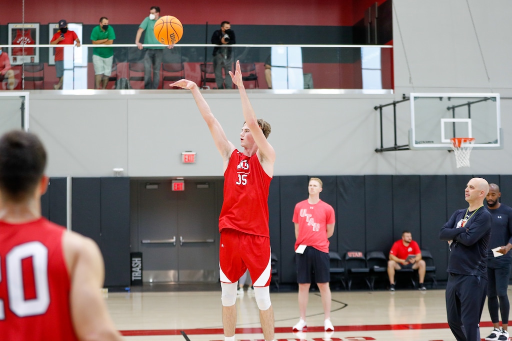 University of Utah center Branden Carlson takes a shot during a recent practice.