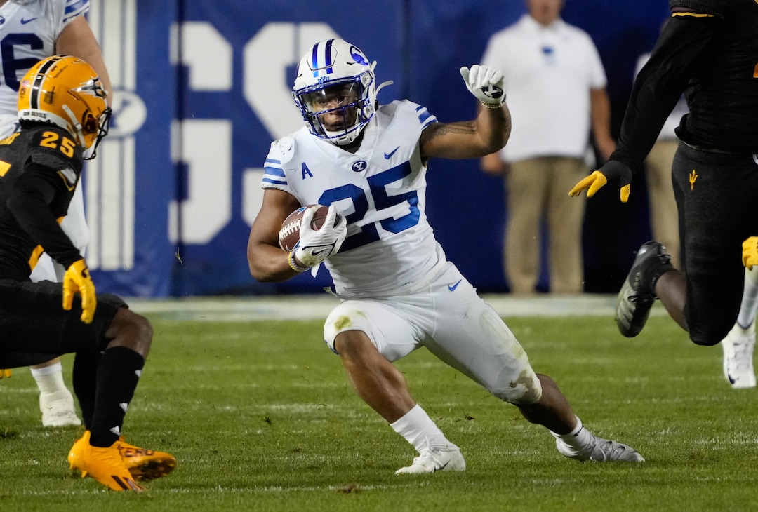 (Francisco Kjolseth | The Salt Lake Tribune) Brigham Young Cougars defensive back Talan Alfrey (25) looks for an opening through the Arizona State Sun Devils defense during game action at LaVell Edwards Stadium in Provo, on Saturday, Sept. 18, 2021.