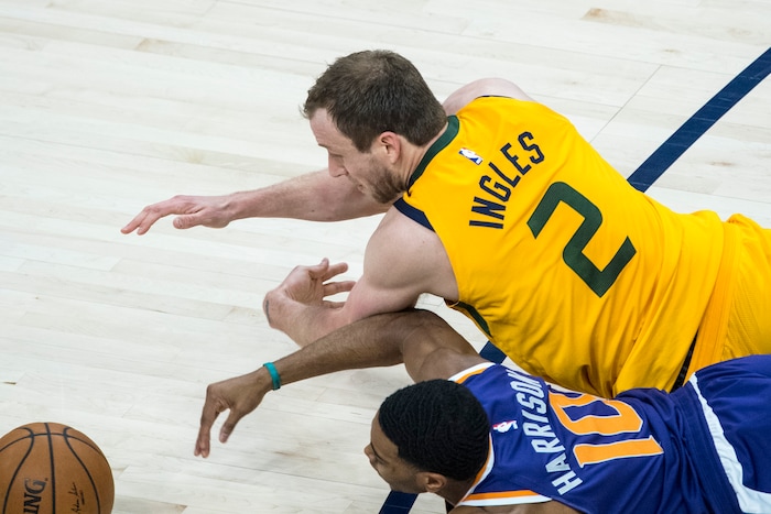 (Chris Detrick  |  The Salt Lake Tribune)  Phoenix Suns guard Shaquille Harrison (10) and Utah Jazz forward Joe Ingles (2) go for the ball during the game at Vivint Smart Home Arena Thursday, March 15, 2018. 
