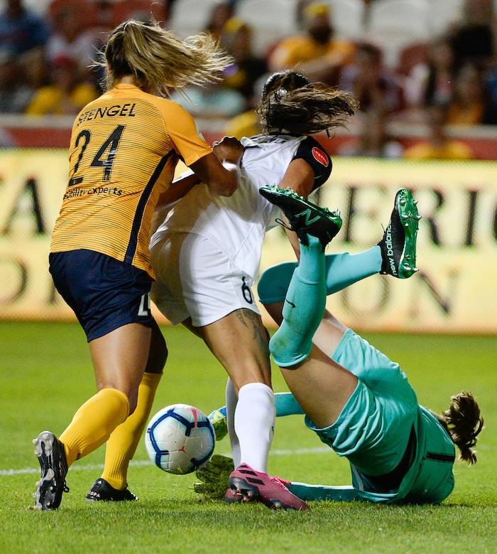 (Francisco Kjolseth  |  The Salt Lake Tribune)  Utah Royals FC forward Katie Stengel (24) battles North Carolina Courage defender Abby Erceg (6) as North Carolina Courage goalkeeper Stephanie Labb (1) gets up ended as Utah Royals FC hosts the North Carolina Courage at Rio Tinto Stadium in Sandy, Utah on Saturday, July 27, 2019.