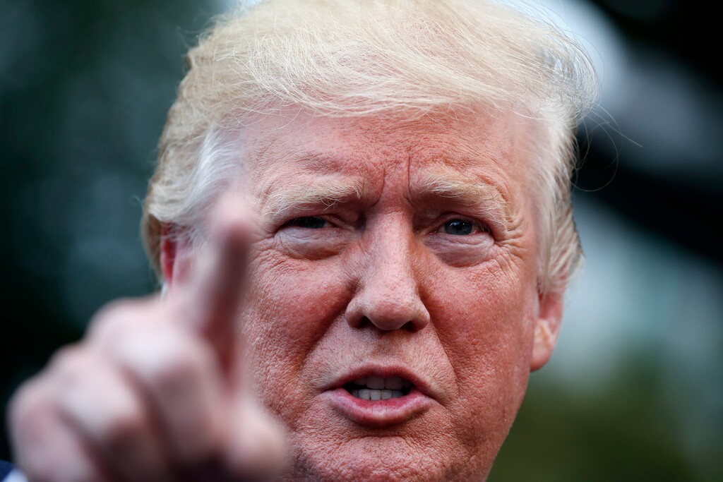 (Alex Brandon | The Associated Press) President Donald Trump speaks with reporters on the South Lawn of the White House before departing, Wednesday, July 17, 2019, in Washington.