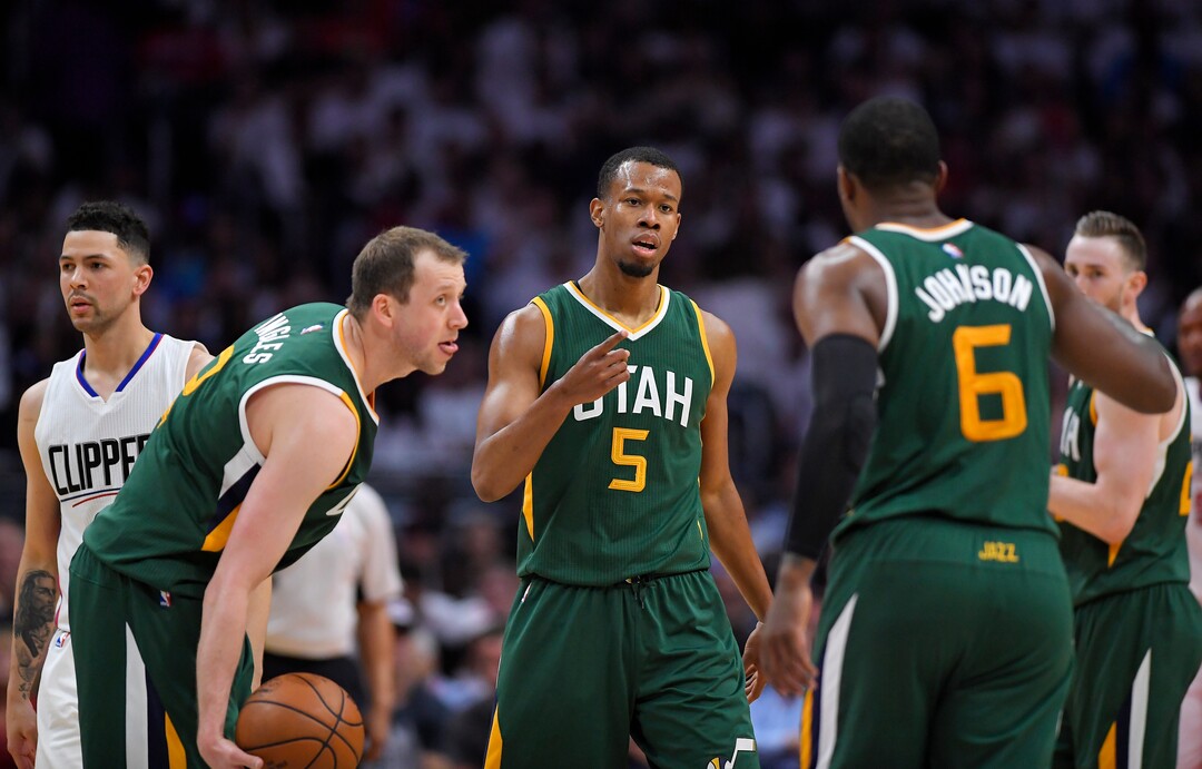 Utah Jazz guard Rodney Hood, center, celebrates with forward Joe Ingles, second from left, of Australia, and forward Joe Johnson, second from right, after scoring as Los Angeles Clippers guard Austin Rivers, left, walks away and forward Gordon Hayward watches during the second half in Game 7 of an NBA basketball first-round playoff series, Sunday, April 30, 2017, in Los Angeles. (AP Photo/Mark J. Terrill)