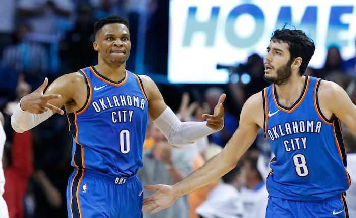 Oklahoma City Thunder guard Russell Westbrook (0) celebrates with Alex Abrines (8) after hitting a basket during the second half of Game 5 of an NBA basketball first-round playoff series against the Utah Jazz in Oklahoma City, Wednesday, April 25, 2018. (AP Photo/Sue Ogrocki)
