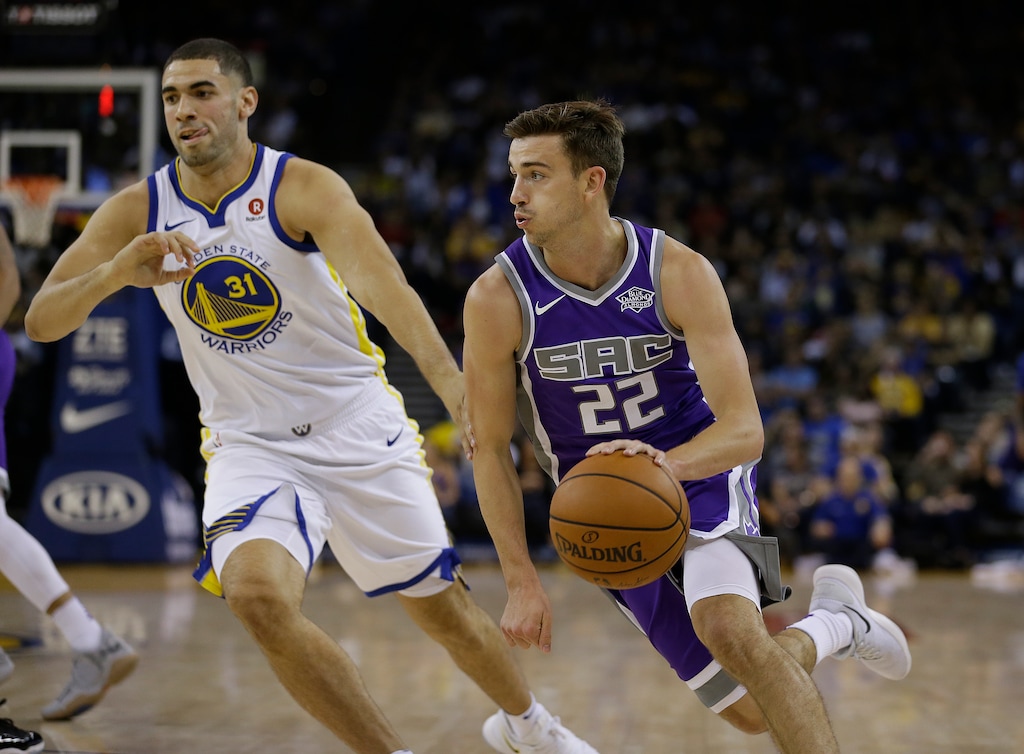 Sacramento Kings guard David Stockton, right, drives to the basket around Golden State Warriors forward Georges Niang during the second half of a preseason NBA basketball game Friday, Oct. 13, 2017, in Oakland, Calif. (AP Photo/Eric Risberg)