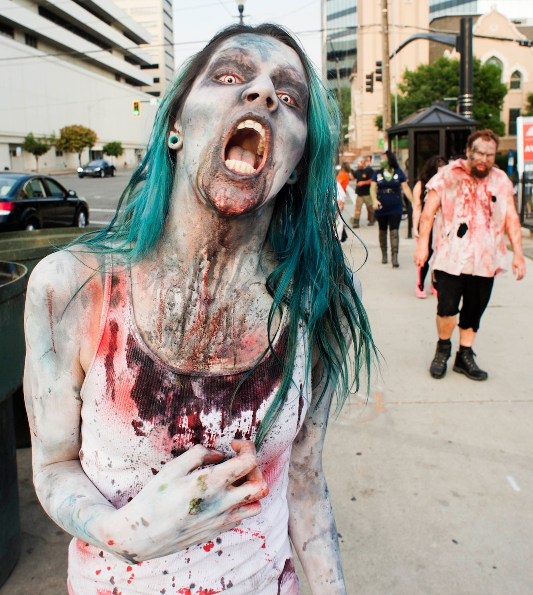    (Rick Egan  |  The Salt Lake Tribune)       A zombie named Satiera walks down 200 South, during the 11th annual Salt Lake Zombie Walk, Sunday, Aug. 26, 2018.