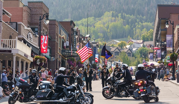 (Leah Hogsten | The Salt Lake Tribune) Park City Police motor squad turn circles on Main Street in Park City on Labor Day, Sept. 6, 2021 during its 125th anniversary celebration of MinersÕ Day.