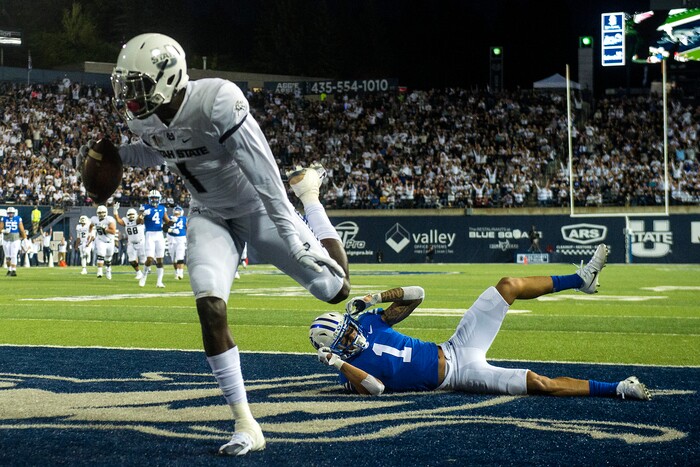(Chris Detrick  |  The Salt Lake Tribune)  Brigham Young Cougars defensive back Troy Warner (1) remains on the ground after letting Utah State Aggies wide receiver Ron'quavion Tarver (1) score a touchdown during the game at Merlin Olsen Field at Maverik Stadium Friday, September 29, 2017.